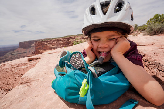 Family With Young Children Biking In Dead Horse State Park, Located Just West Of Moab, Utah.