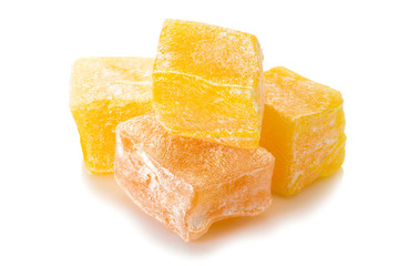 Turkish delight. Honey rahat locum, four pieces of sweet oriental delights in powered sugar. Close-up view.