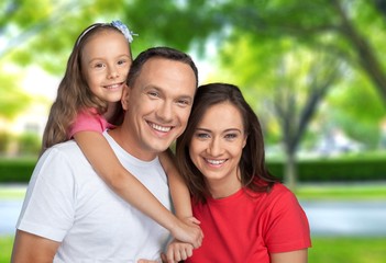 Obraz premium Beautiful Lovely family in the green park