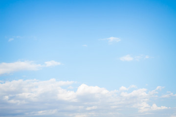 White fluffy clouds in the blue sky in summer