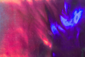 Holographic background. Abstract shiny cheerful wallpaper image. Cheerful disco festive foil....