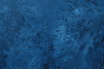 Fototapeta na wymiar Navy blue colored dark Concrete textured background with roughness and irregularities to your design or product. Color trend concept.