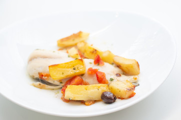 fish with potatoes, baked sea bream