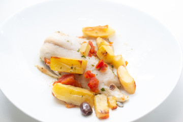 fish with potatoes, baked sea bream