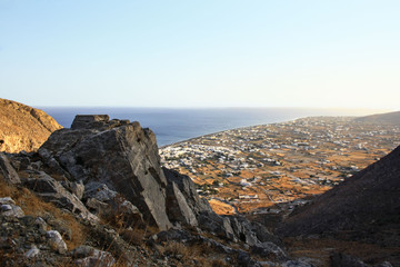 Fototapeta premium View of the village of Perissa on the island of Santorini extending from the trail leading to the peak of Profitis Ilias