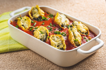 shell-shaped pasta stuffed with spinach and cheese