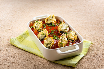 shell-shaped pasta stuffed with spinach and cheese