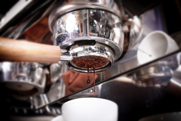 Making espresso coffee in coffeeshop or cafe closeup