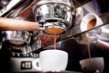 Making espresso coffee in coffeeshop or cafe closeup