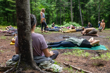 Diverse people enjoy spiritual gathering A multiethnic group of people of all ages are seen seeking...