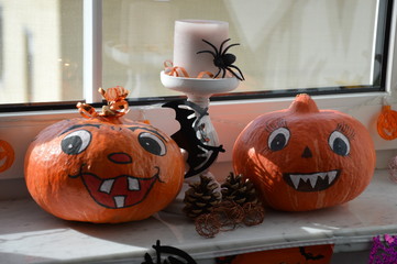 Halloween pumpkin and pumpkin on the windowsill