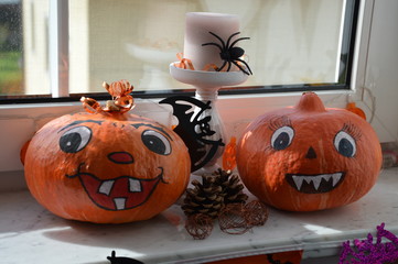 Halloween pumpkin and pumpkin on the windowsill
