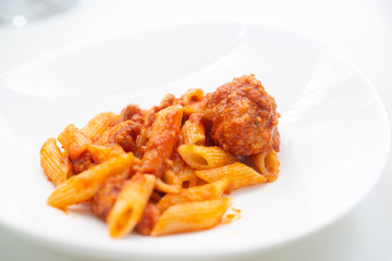 Italian pasta with tomato sauce and meatballs