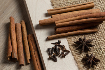 cinnamon sticks and star anise on wooden background
