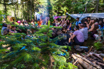 Naklejka na ściany i meble Diverse people enjoy spiritual gathering An intergenerational and multiethnic group of individuals are seen spending time together in nature, experiencing shamanic and native traditional cultures.