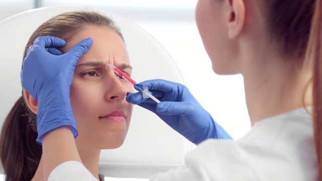 Botulinum toxin injections for glabellar lines close-up