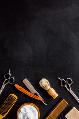 Barbershop concept. Hairdressing tools on black background top view space for text