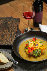 Vegetable curry with mango. Exquisite dish. Creative restaurant meal concept.	
