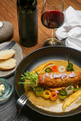 Chicken katsu on mango curry. Exquisite dish. Creative restaurant meal concept.	