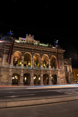 Fototapeta na wymiar Vienna Opera House at Night, Traffic passing by 01