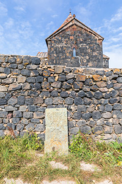 Western Asia, Eurasia, South Caucasus, Republic of Armenia. Sevan. Carved stone tablet outside of the church of Surp Arakelots at the Sevanavank Monastery complex on Lake Sevan.