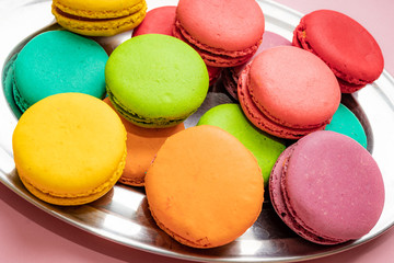 colorful almond cookies  on pink background