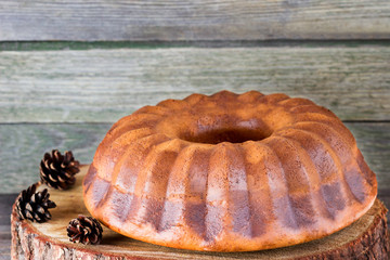 Cupcake with nuts and candied fruit on a stump.