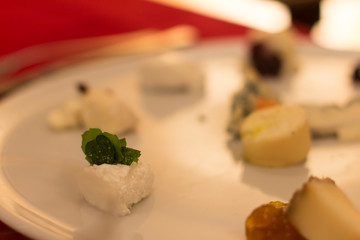 Close up on a large dish with a selection of local cheese