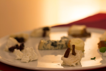 Close up on a large dish with a selection of local cheese