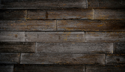 Cool dark brown reclaimed wood bamboo surface. Wooden planks on a wall or floor with grain and texture. Neutral stained vintage wood background.