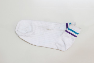 Old dirty socks on white background