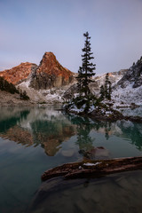 Beautiful View of a Glacier Lake in the Canadian Mountain Landscape during a colorful and vibrant sunset in Fall Season. Taken in Watersprite Lake, Squamish, North of Vancouver, BC, Canada.