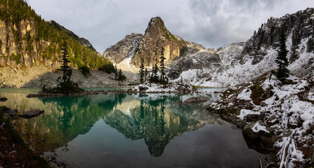 Beautiful Panoramic View of a Glacier Lake in the Canadian Mountain Landscape during a colorful and vibrant sunset in Fall Season. Taken in Watersprite Lake, Squamish, North of Vancouver, BC, Canada.