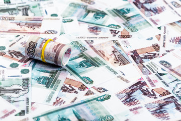 selective focus of cash roll on russian banknotes