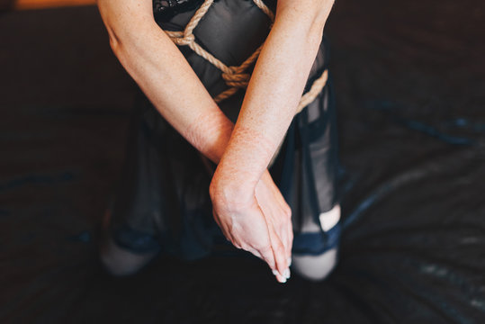 Shibari style photo shoot. Body parts. Silk lingerie and ropes.