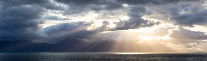 Beautiful Panoramic View of American Mountain Landscape on the Ocean Coast during a cloudy and colorful sunrise in fall season. Taken in Glacier Bay National Park and Preserve, Alaska, USA. © edb3_16