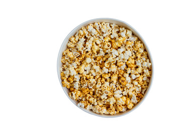 Scattered sweet  popcorn in bowl . Top view