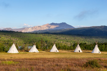 Beautiful View of the Tipi in a field with American Rocky Mountain Landscape in the background...
