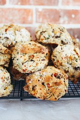 Savoury Muffins cooling on tray and brick wall