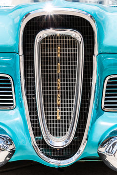 Infamous front grill from a classic blue Ford Edsel. 