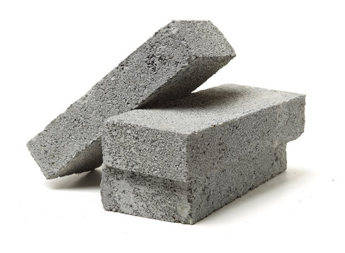 Fototapeta Gray cement solid brick isolated on a white background 