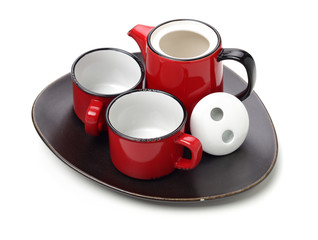 Red teapot and cups on white background