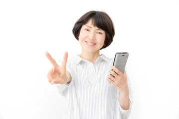 Fototapeta premium 女性 ミドルエイジ ピース