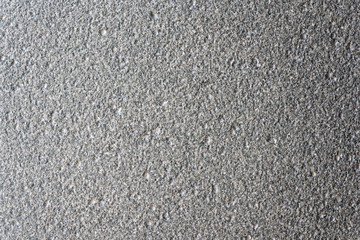 Granite slabs are gray-black, porous and rough.