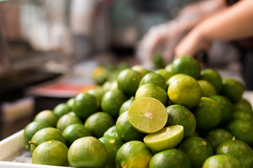 green lemon slices are placed in order to squeeze the juice.