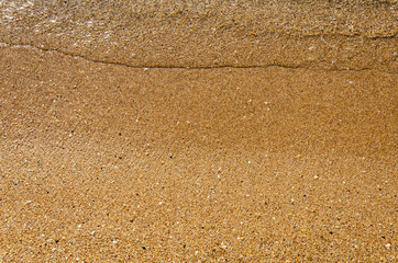 Beach with Golden sand and clear water in summer on the sea.