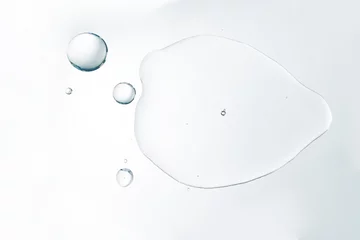 Fotobehang Cosmetic liquid or water serum on white background © kaedeezign