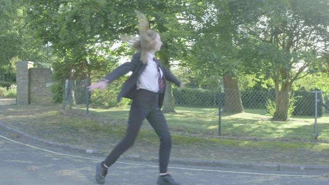 Senior school girl practising ballet on the way to school themes of ballet carefree routines education 