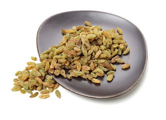 Raisins on white background