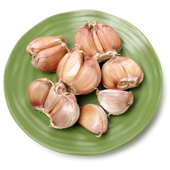 Garlic press and garlic on white background 